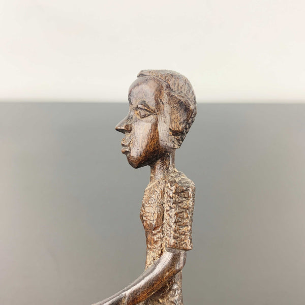 Miniature vintage hand carved timber tribal figurine