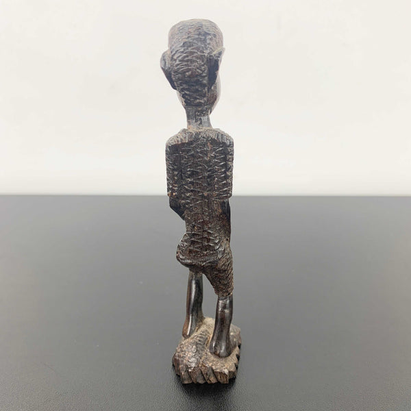 Miniature vintage hand carved timber tribal figurine