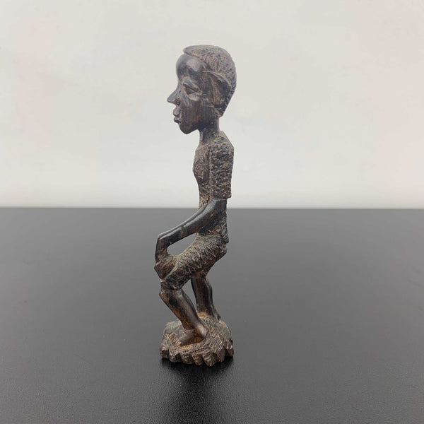 Miniature vintage hand carved timber tribal figurine