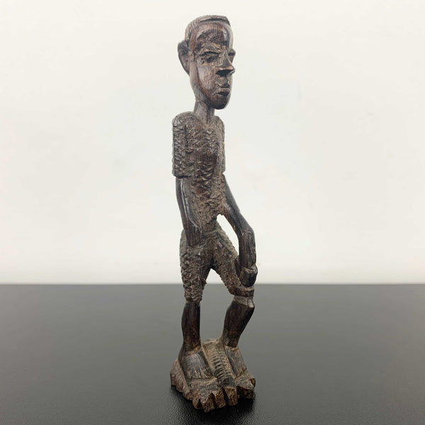 Miniature vintage hand carved timber tribal figurine