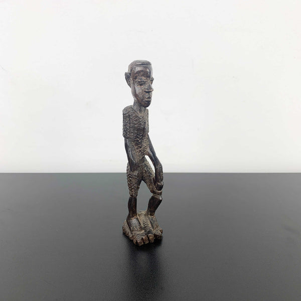 Miniature vintage hand carved timber tribal figurine