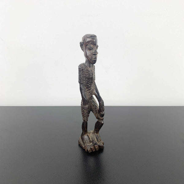 Miniature vintage hand carved timber tribal figurine
