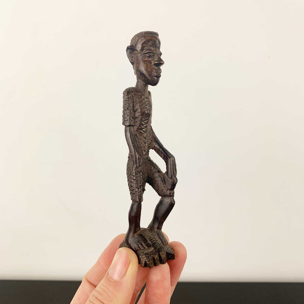 Miniature vintage hand carved timber tribal figurine