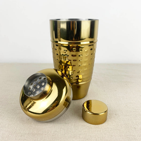 Gold cocktail shaker with hammered finish