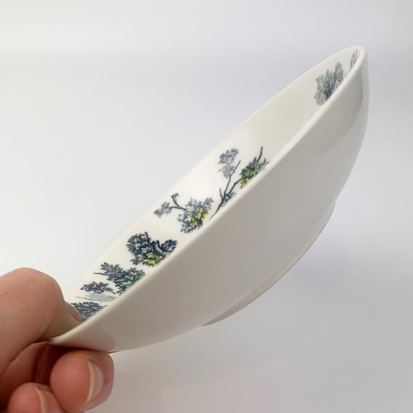 Pretty Japanese ceramic trinket bowl held to indicate size