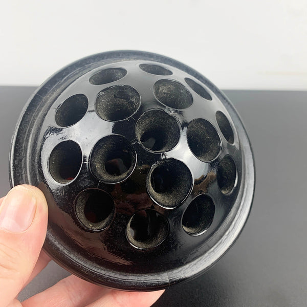 Antique black glass 16 hole flower frog c1916