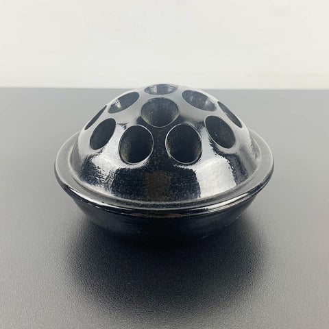 Antique black glass 16 hole flower frog c1916