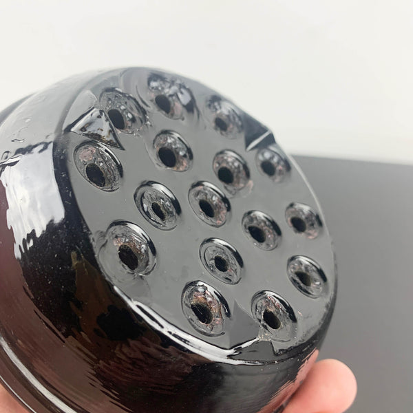 Antique black glass 16 hole flower frog c1916