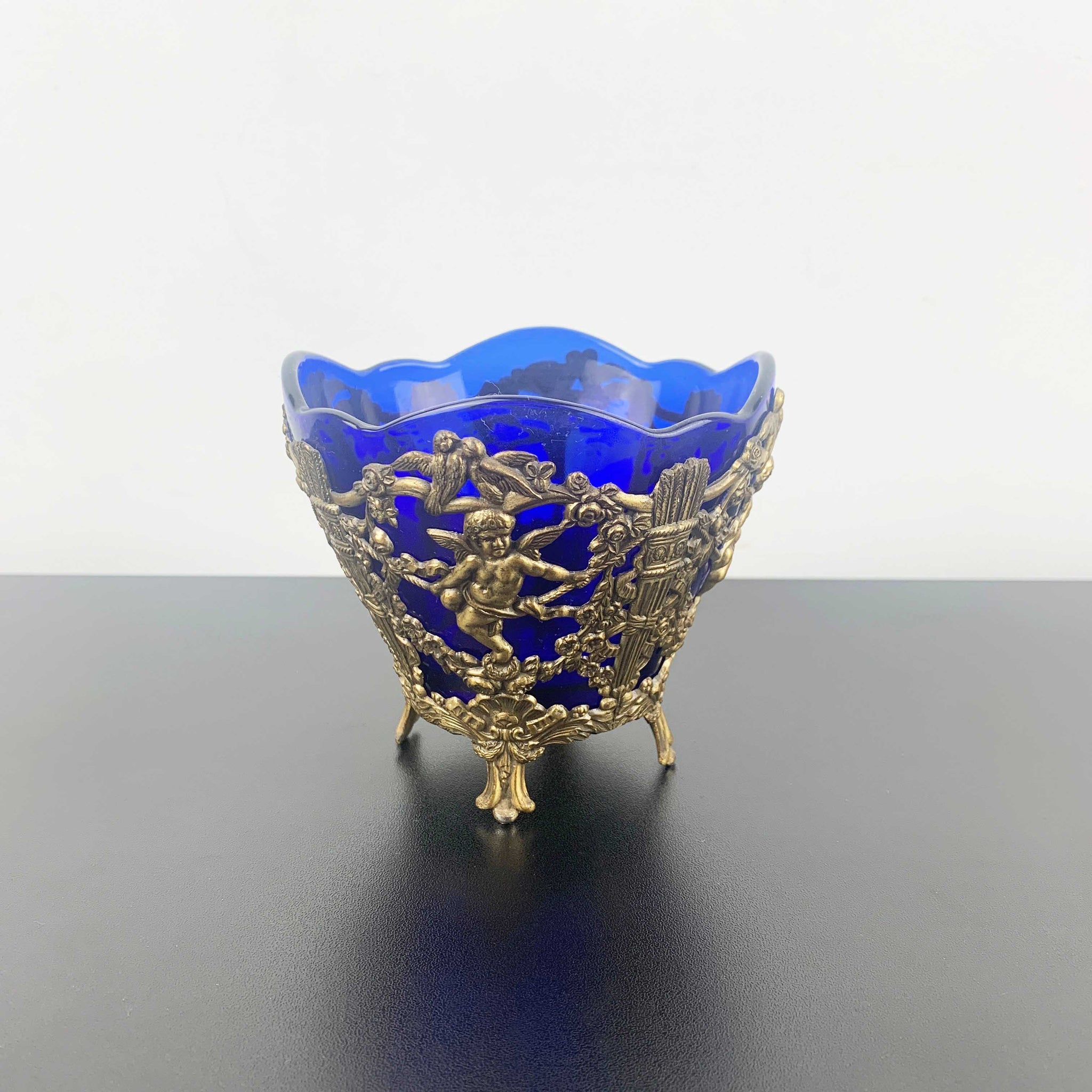Corbell & Co ornate cherub footed bowl with cobalt blue glass insert