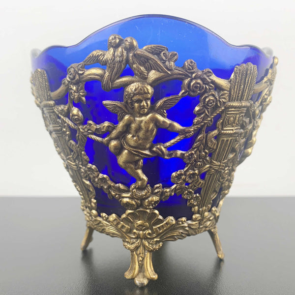 Corbell & Co ornate cherub footed bowl with cobalt blue glass insert