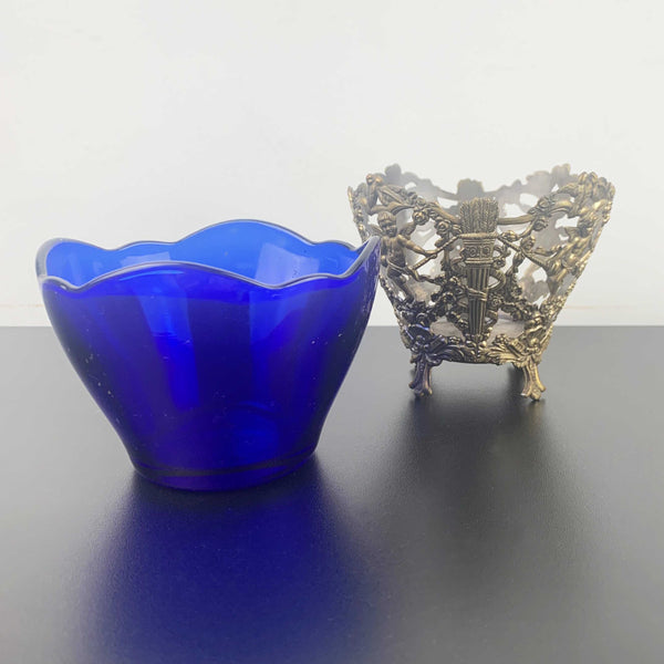 Corbell & Co ornate cherub footed bowl with cobalt blue glass insert