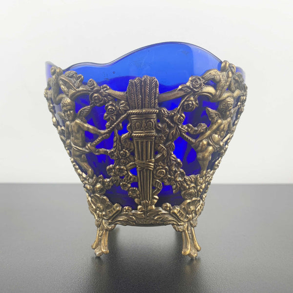 Corbell & Co ornate cherub footed bowl with cobalt blue glass insert
