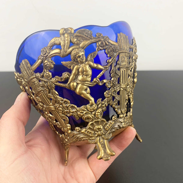 Corbell & Co ornate cherub footed bowl with cobalt blue glass insert