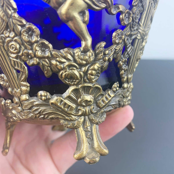 Corbell & Co ornate cherub footed bowl with cobalt blue glass insert