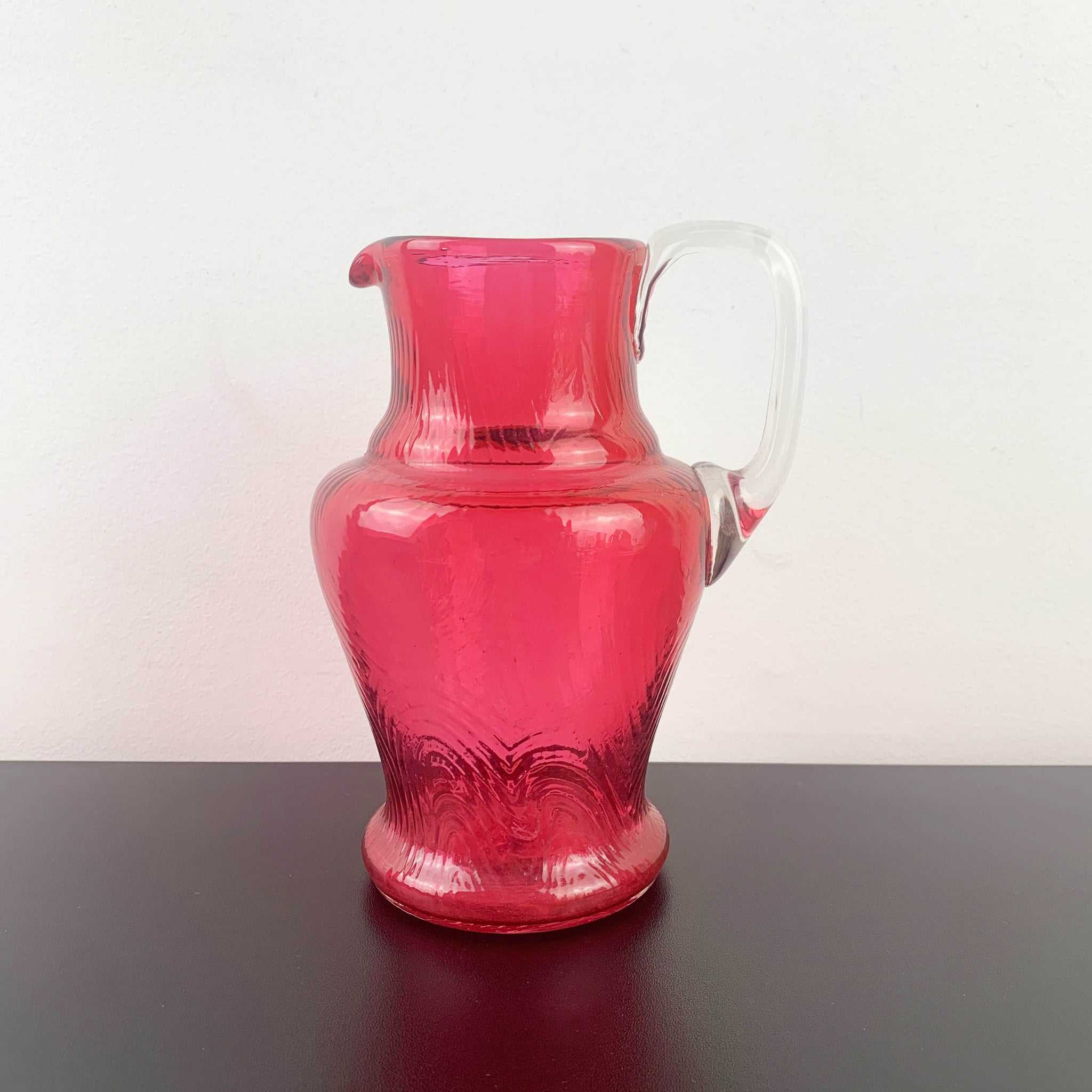 Small antique cranberry glass hand blown jug