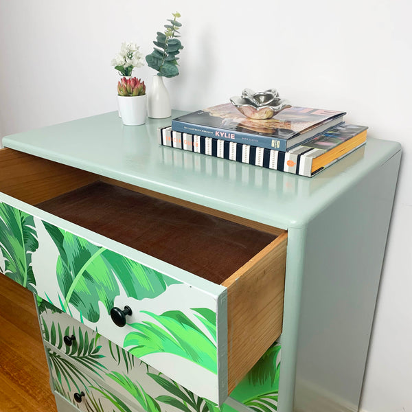 Beautiful sage green 4 drawer chest featuring a fern design artwork with drawer open