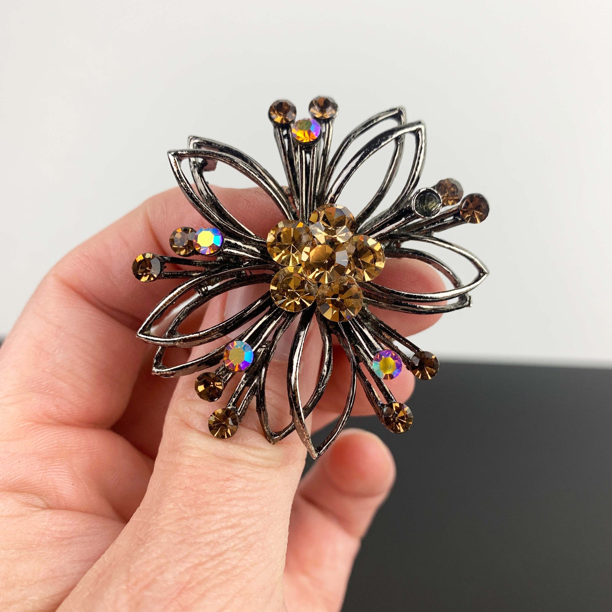 Mid century flower shaped amber rhinestone brooch