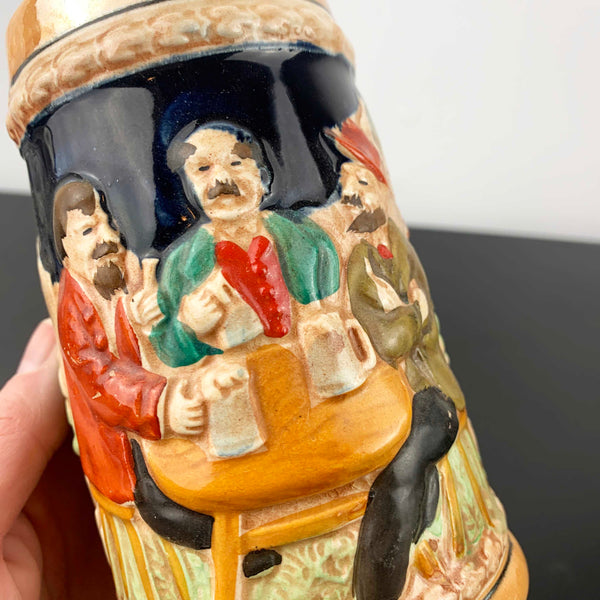 German relief moulded pottery beer stein