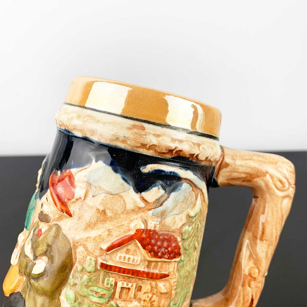 German relief moulded pottery beer stein
