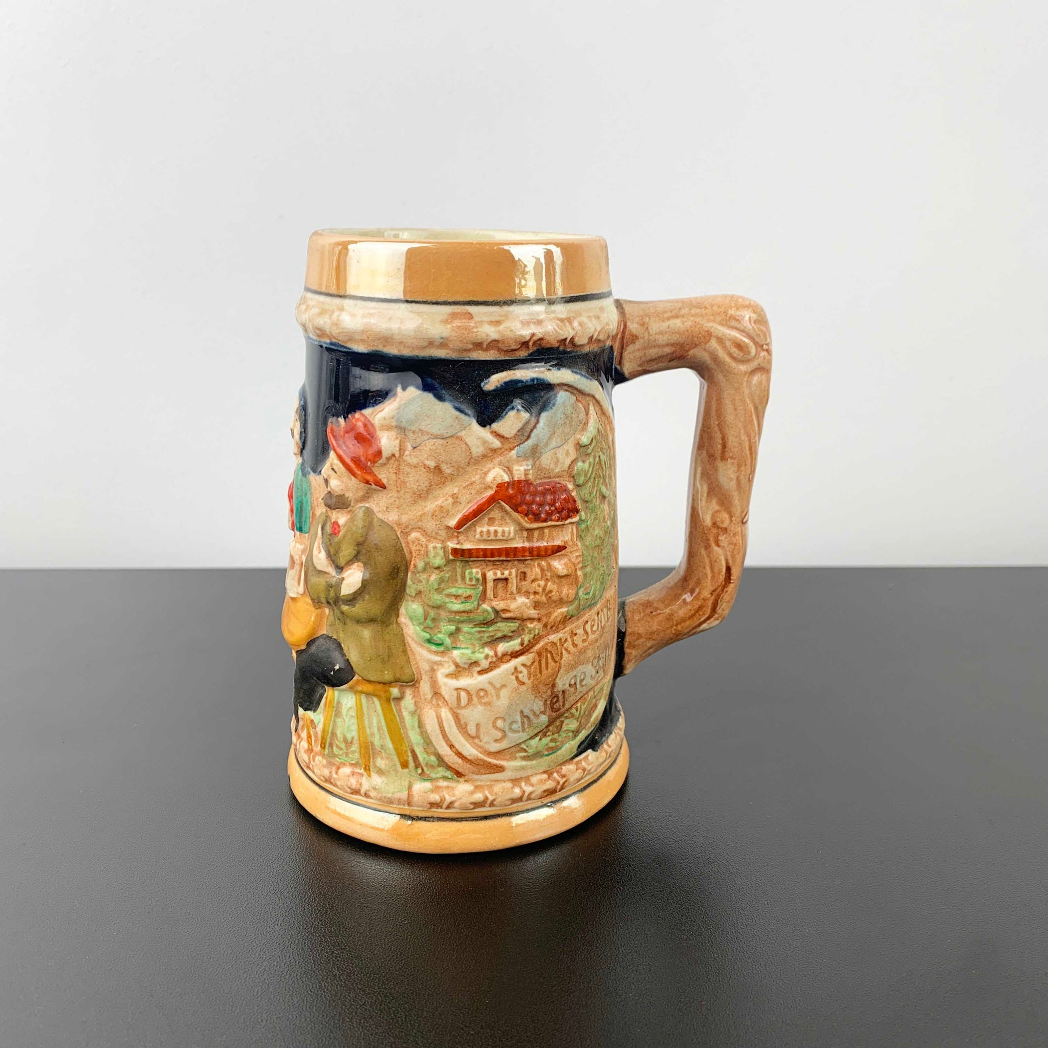 German relief moulded pottery beer stein