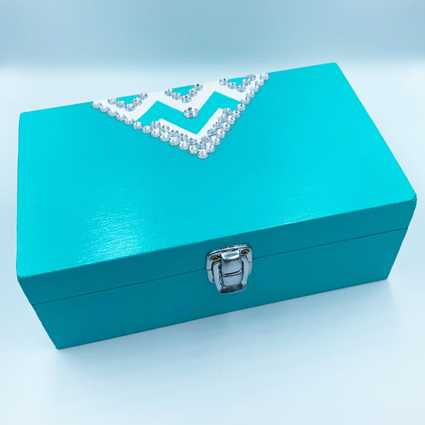 Restored wooden storage box in bright aqua