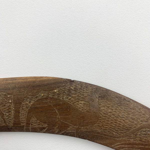 Aboriginal hand made boomerang with intricate carved kangaroo art