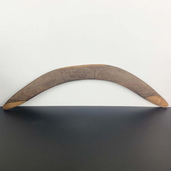 Aboriginal hand made boomerang with intricate carved kangaroo art