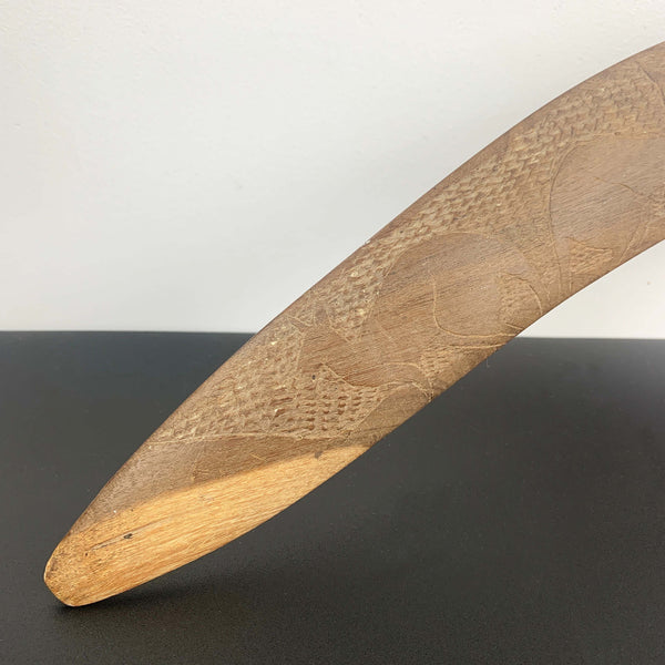 Aboriginal hand made boomerang with intricate carved kangaroo art