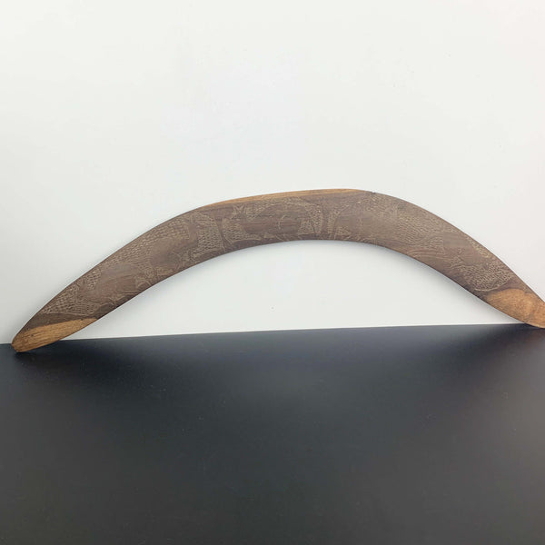 Aboriginal hand made boomerang with intricate carved kangaroo art