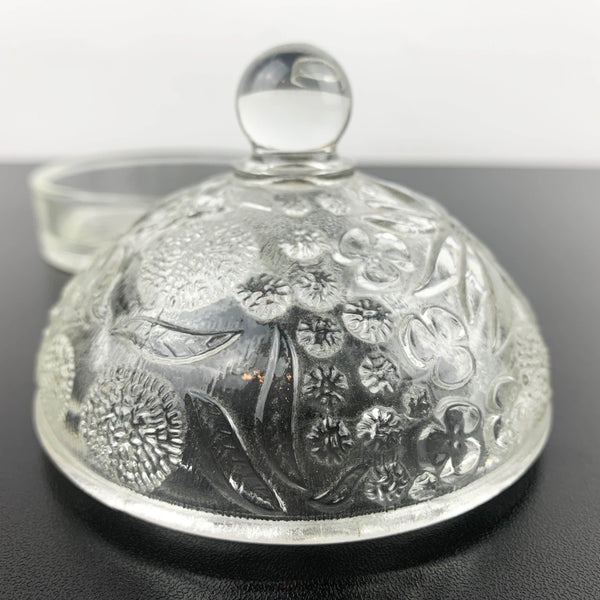 Glass butter dish with domed embossed floral lid