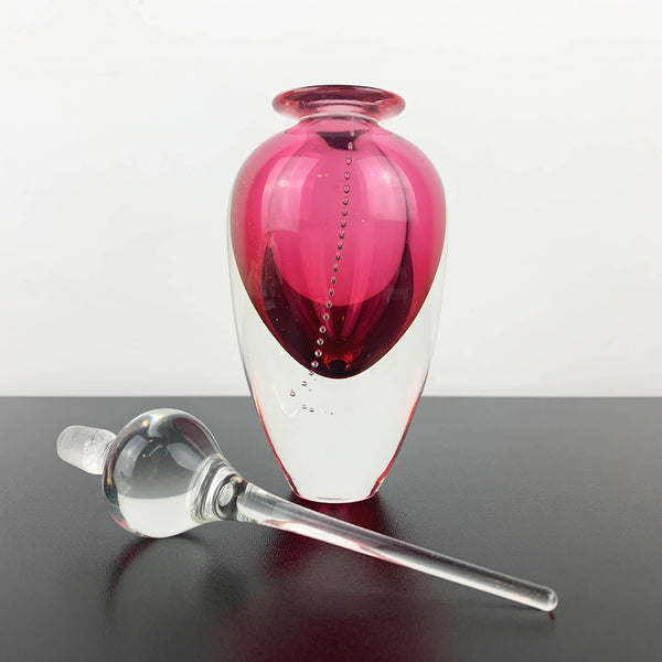 Art glass perfume bottle in pink by Michael Hook
