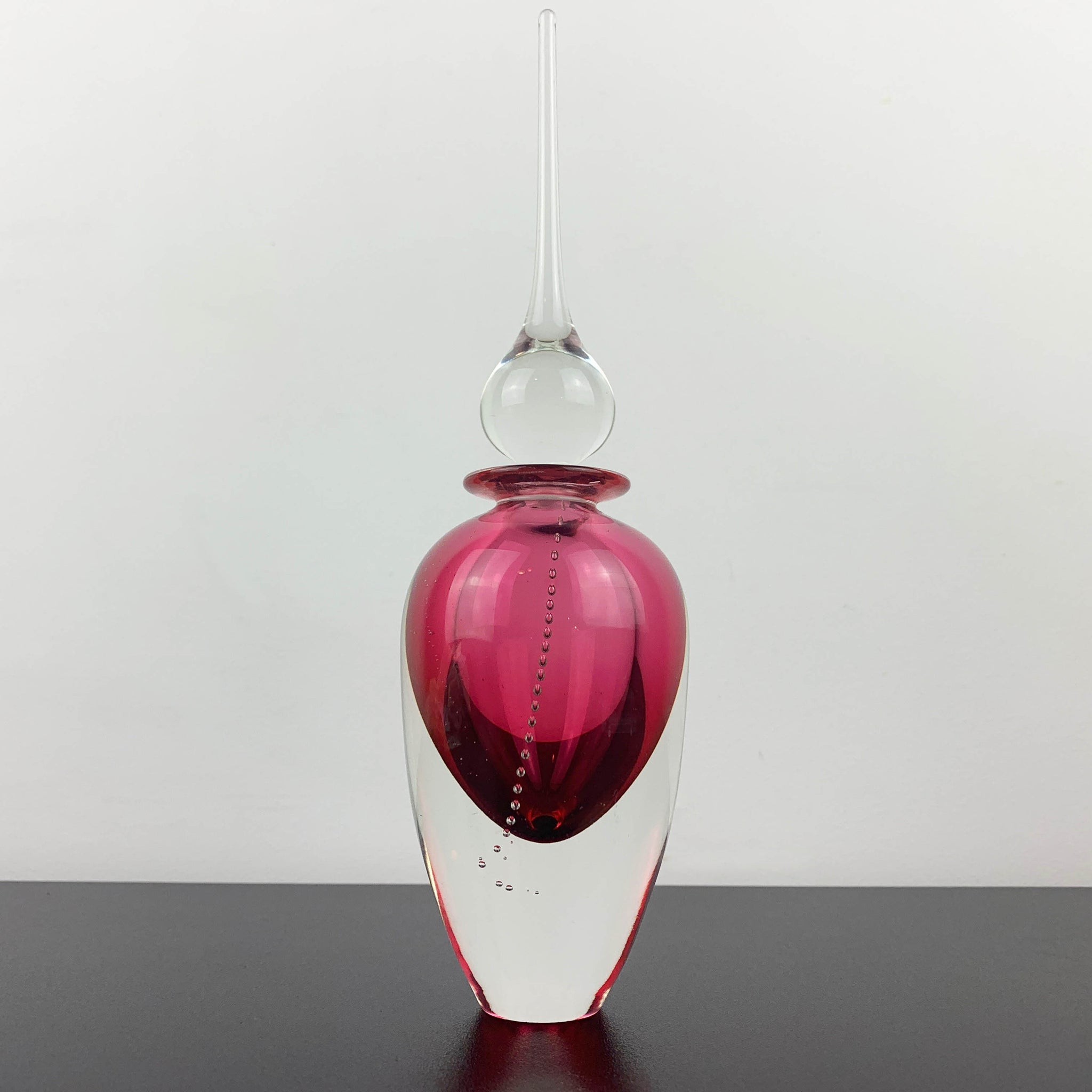 Art glass perfume bottle in pink by Michael Hook