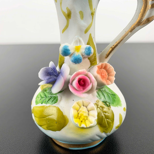 Miniature Victorian style jug ornament with applied floral decoration