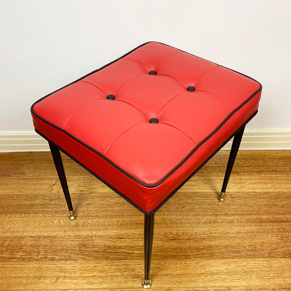 Mid century red vinyl stool with black button tufting