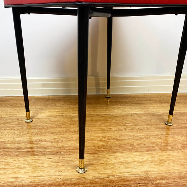 Mid century red vinyl stool with black button tufting