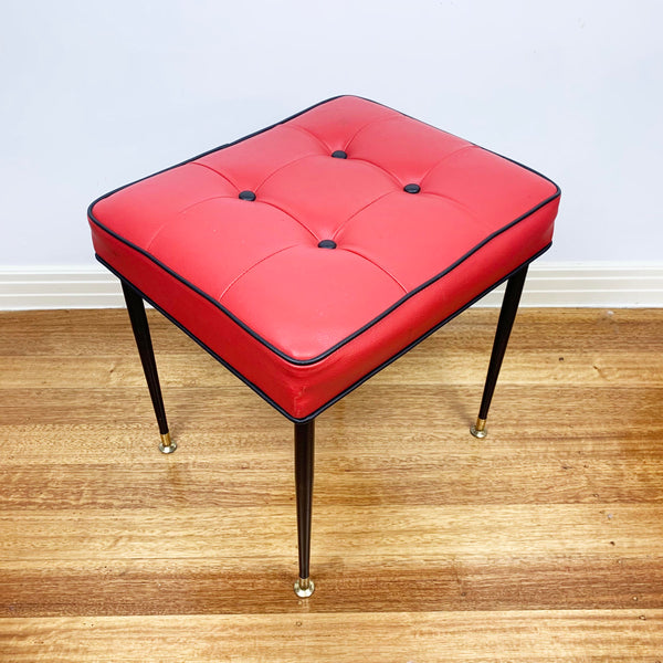Mid century red vinyl stool with black button tufting