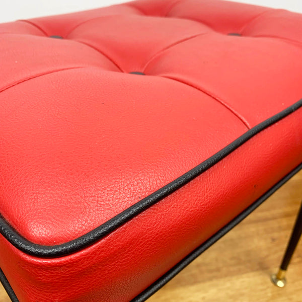 Mid century red vinyl stool with black button tufting