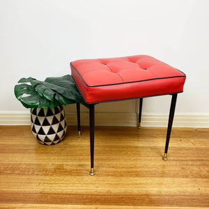 Mid century red vinyl stool with black button tufting