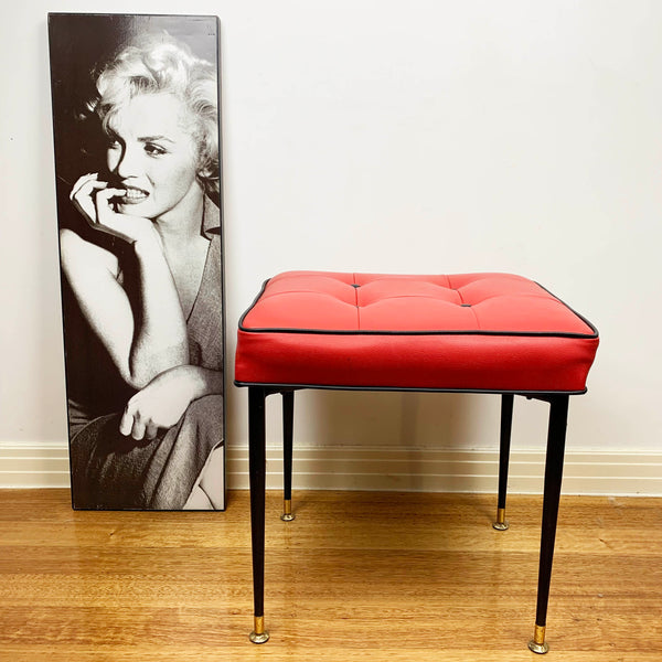 Mid century red vinyl stool with black button tufting