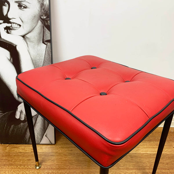Mid century red vinyl stool with black button tufting