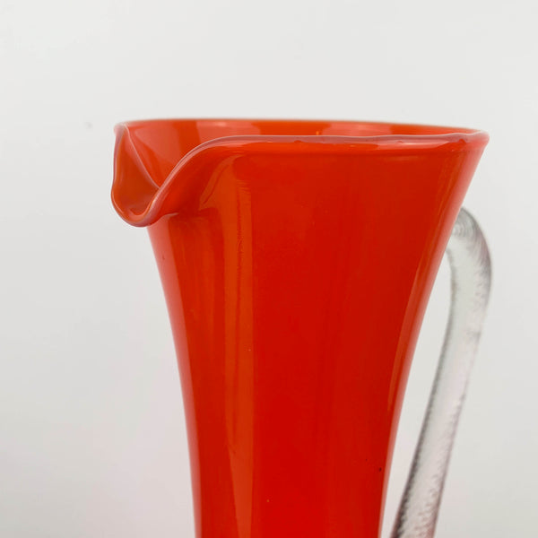 Stelvia Glass Empoli Orange Pitcher with Twist Handle and Swirl Pattern Detail