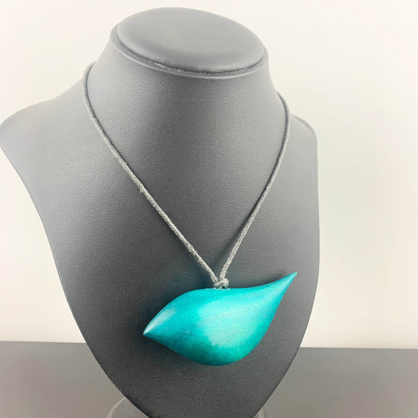 Hand crafted wooden bird necklace in teal