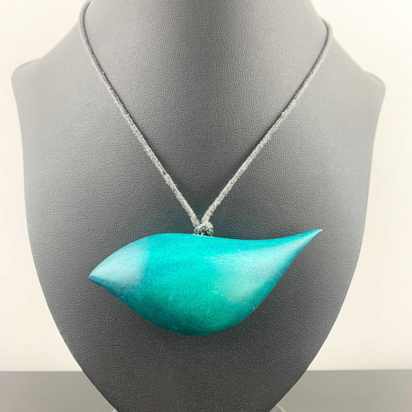 Hand crafted wooden bird necklace in teal