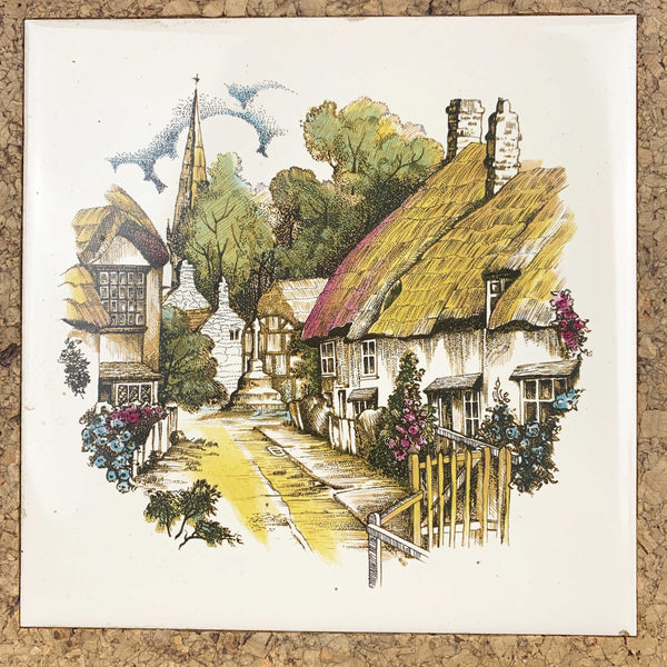 Thatched cottage village scene tile trivet with cork surround