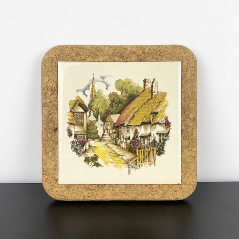 Thatched cottage village scene tile trivet with cork surround