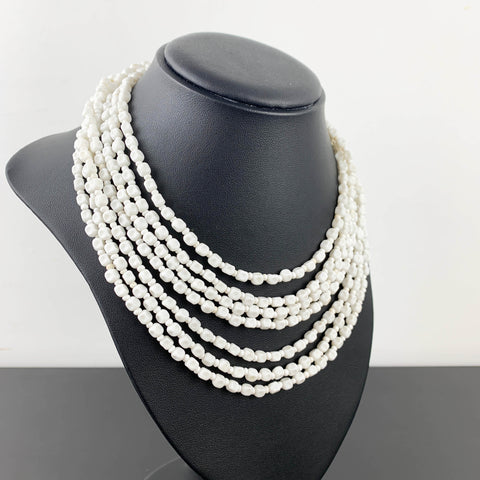 White beaded multi strand necklace